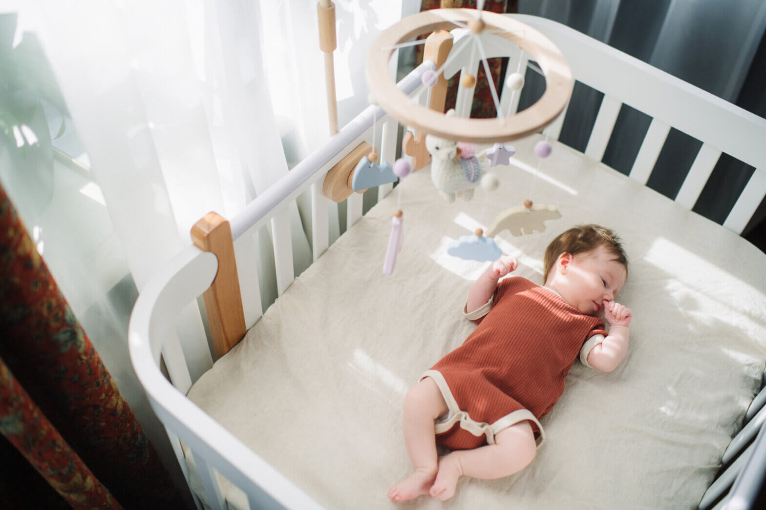Baby laying in crib